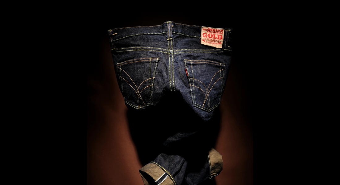 Japanese selvedge denim jeans by The Strike Gold, dark indigo back view with signature pocket stitching.